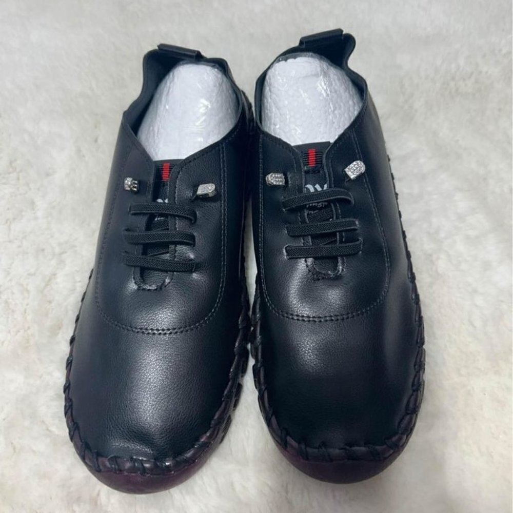 Woman’s fashion sneakers. Brand new. Size 41. Slip on.